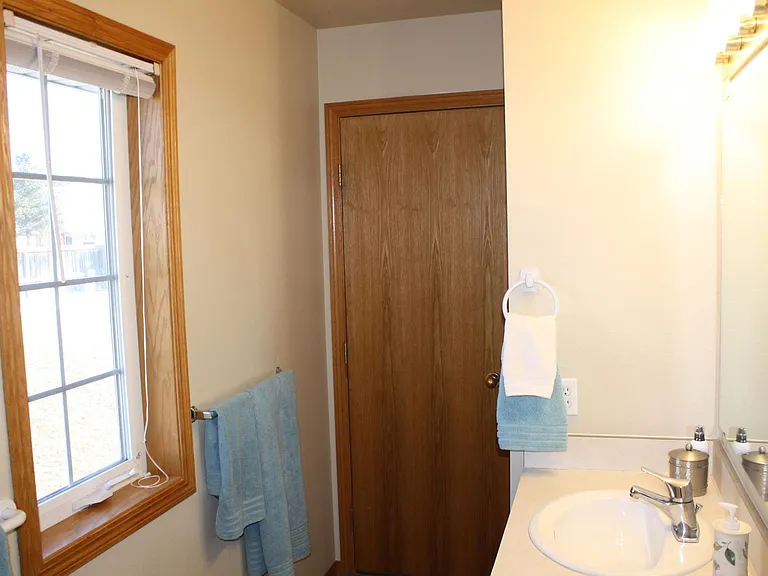 Master Bathroom with Shower/Tub enclosure.