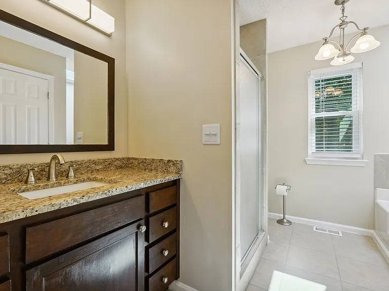 Primary bath with walk in shower, deep tub and skylight!