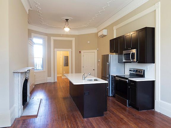 Open floor plan with new kitchen and appliances including ice maker, disposal and microwave.