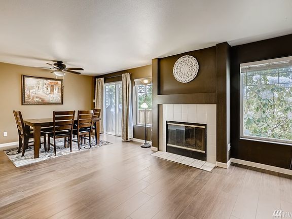 Spacious living room with a cozy fireplace.