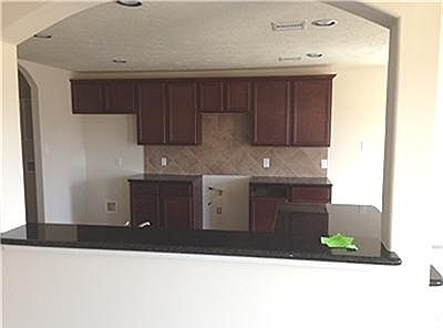  Another view of your kitchen from your new breakfast bar with granite counter top.