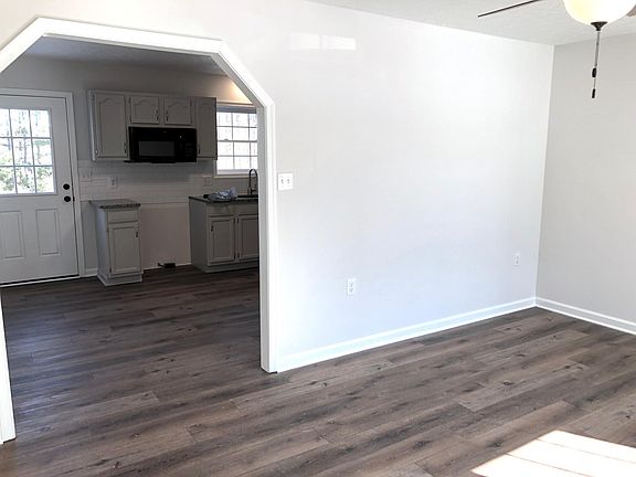 Bright living room with direct access to kitchen