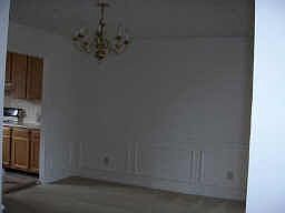 Formal dining room with wainscoting.
