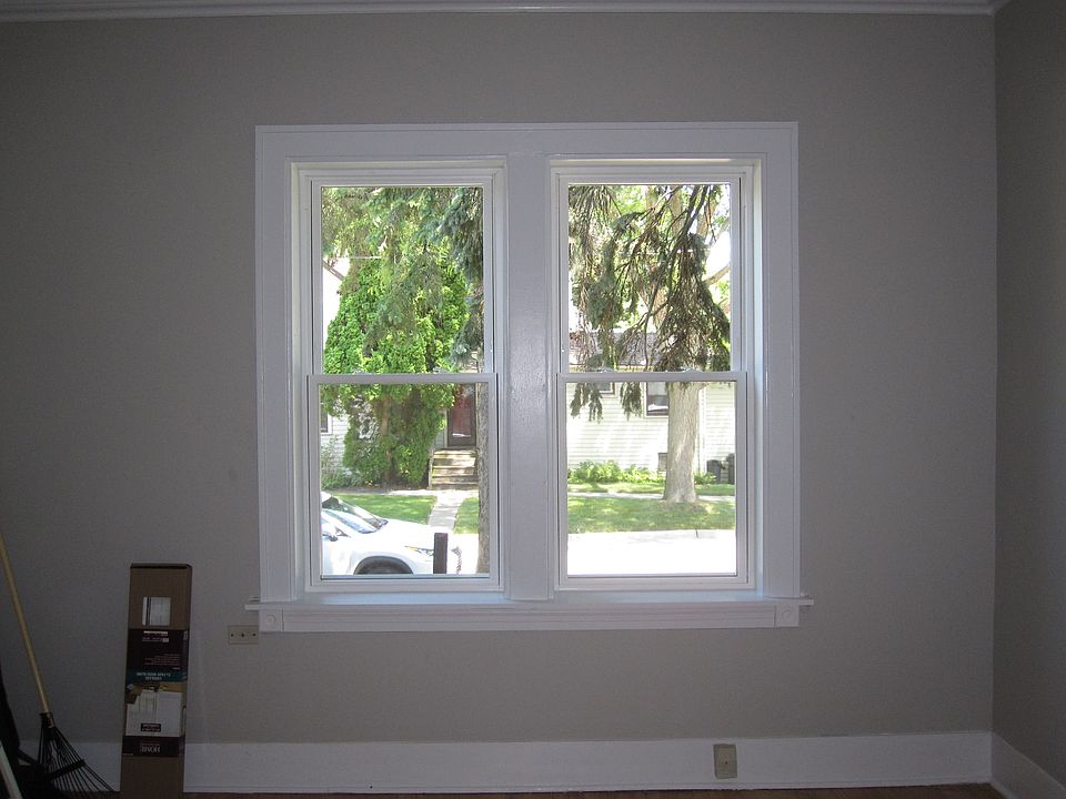 picture of large dinning room from kitchen to the outside. ALL WINDOWS ARE NEWER THERMOPANE VYNIL Windows