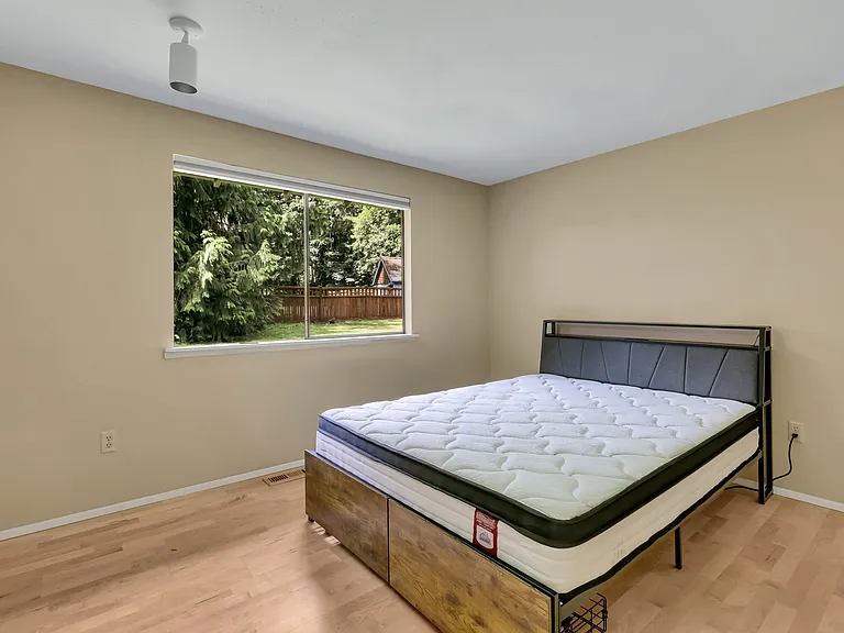 One of the bedrooms. Not shown is the primary and another bedroom as they were being painted.
