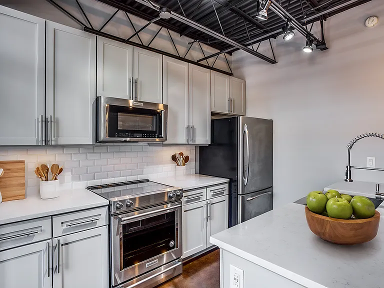 Make your culinary dreams a reality in this elegantly updated galley kitchen (virtually staged)