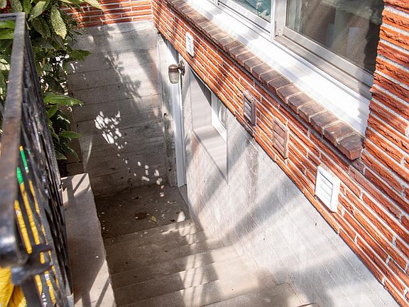 Stairs to basement apartment entry.