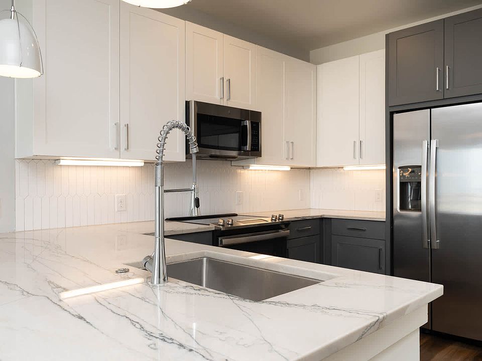 Kitchen with Marble Countertops and Stainless Steel Appliances