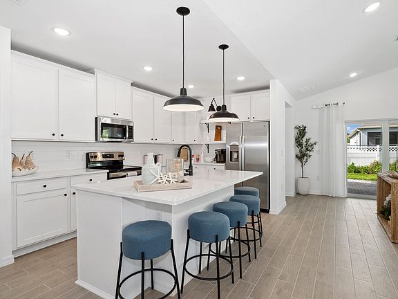 Kitchen adjacent to great room