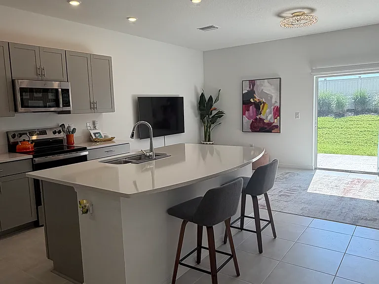 Open concept: kitchen with dining counter.
