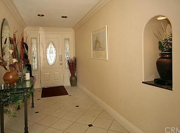 Entry way, newer front door, niche for art