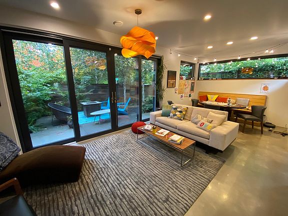 Living Room, with adjacent patio and fire pit areas.