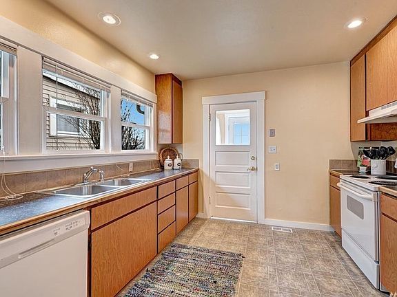 Kitchen and door to backyard and parking.