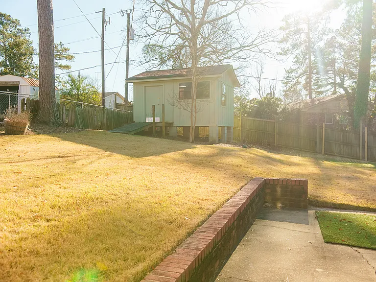 Half Acre Lot New Sod With Storage Shed
