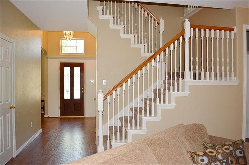 Grand Entry with Laminate Wood Flooring throughout downstairs living areas