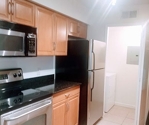 kitchen into open laundry room