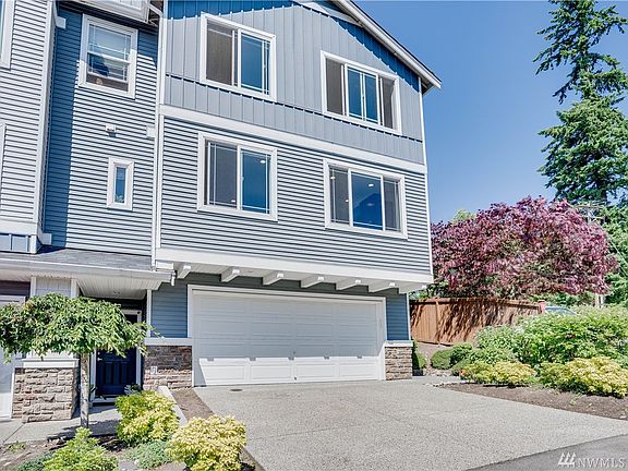 Two-car garage and space for more parking in driveway.