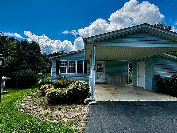 Attached carport and shed 