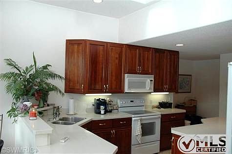 Cherry cabinets, all kitchen appliances included, center island.