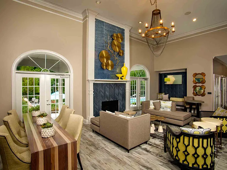 Resident lounge with fireplace and plush seating
