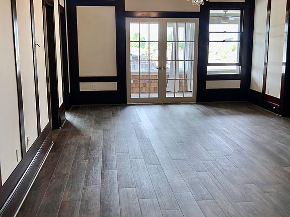 Living room from front door, French doors lead to sunroom and views