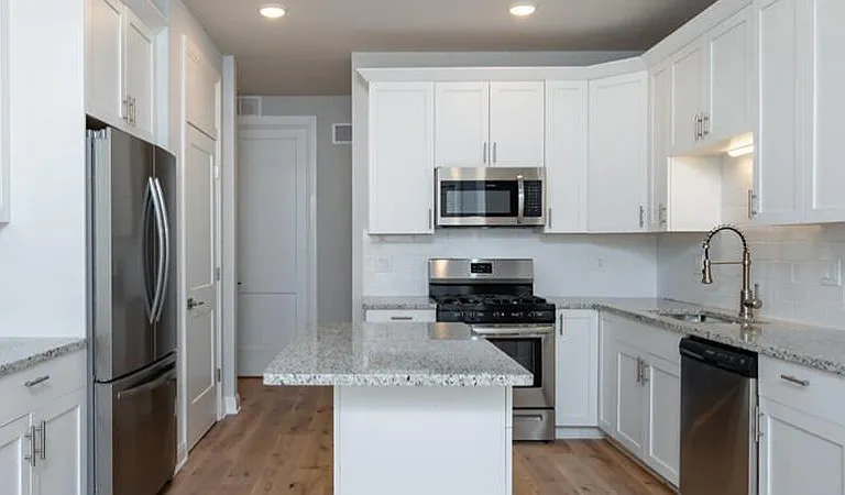 42" Kitchen Cabinets and Modern Appliances Abound