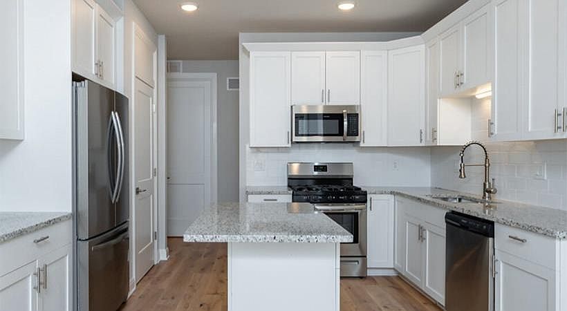 42" Kitchen Cabinets and Modern Appliances Abound
