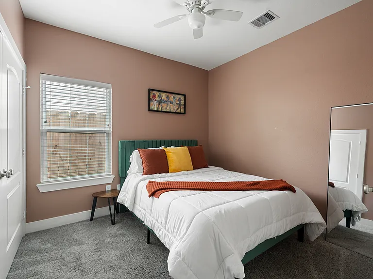 Bedroom 2: Furnished private bedroom _ $900/month, shares hallway bathroom.