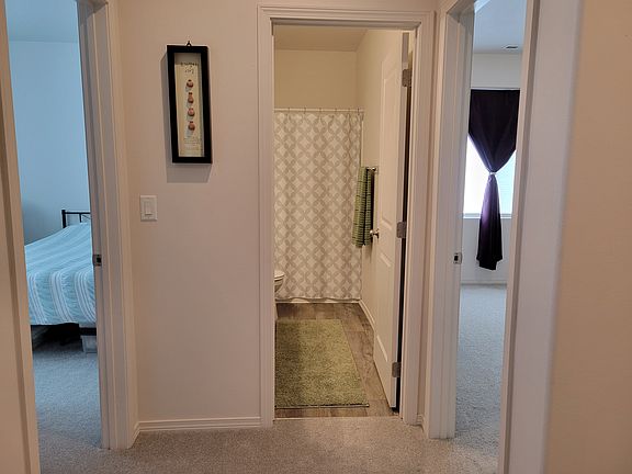Front entry facing two bedrooms and hall bath
