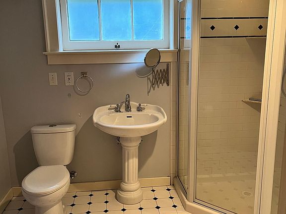 Bathroom with combined laundry room.