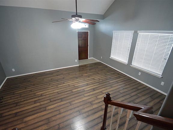 SECOND VIEW OF LIVING AREA TO TILED ENTRY.