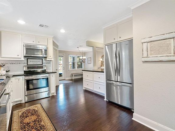 The kitchen features updated appliances, plenty of storage and there's even room for an island.