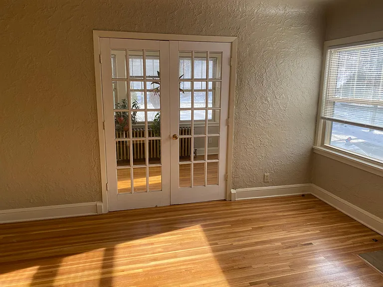 Living room, looking into sunroom.