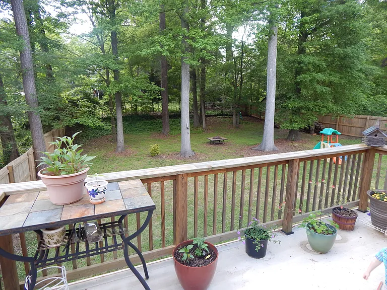 Large composite deck with few stairs to the back yard.
