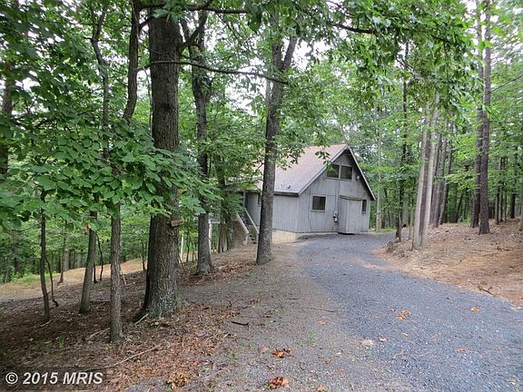 Rear View of House w/ Gravel Driveway