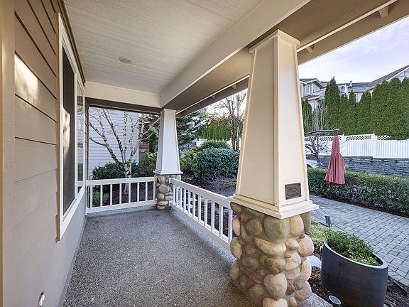 Covered porch for year-round enjoyment.