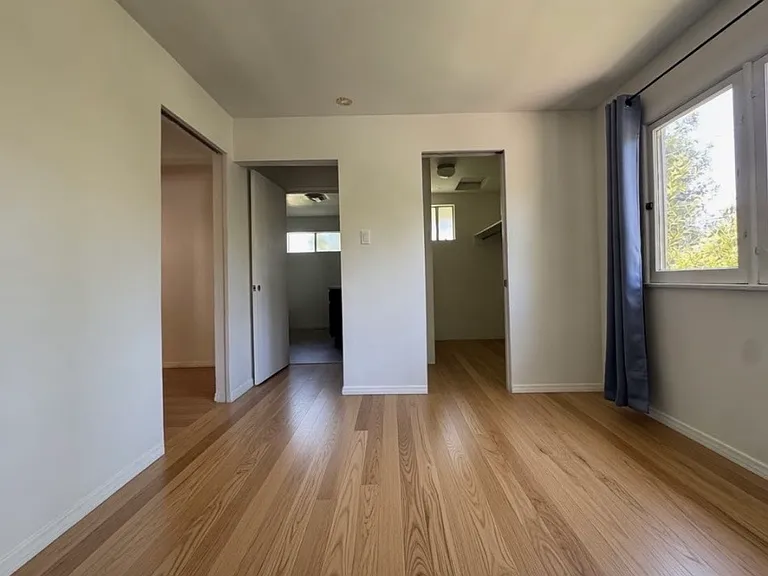 BR2 with new flooring(currently being installed. AI pic shows approx color).