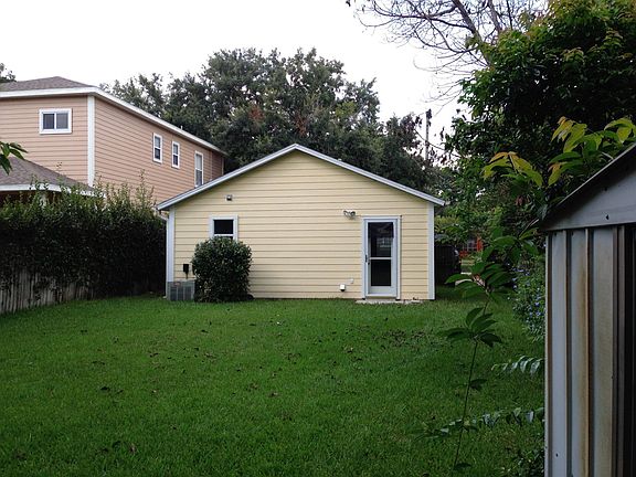 Spacious back yard with storage shed