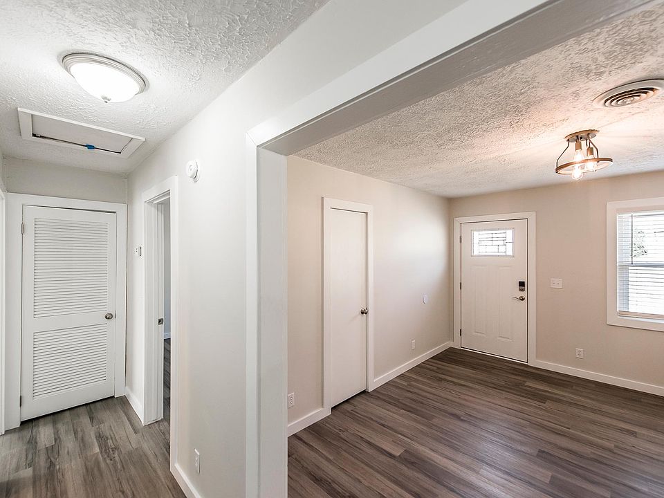 To the left - hallway to bedrooms and bathroom; to the right - living room and front door
