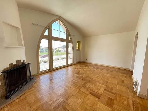 Perfect for entertaining, this spacious living room (with working fireplace), overlooks the park -- and the beautiful and original wood floors have been recently refinished. Taraval Street is the main shopping corridor servicing the Parkside and the L T