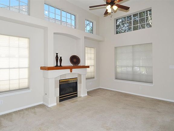 A wonderful space with lofty ceilings and natural light. A definitive gas fireplace anchors the room and chases the chill in cooler weather.