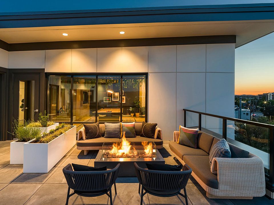 Experience the peak of sophisticated outdoor living at Modera Beaverton's incredible rooftop deck and bar lounge.