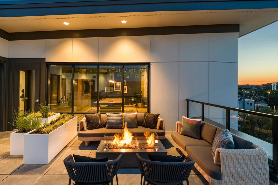 Experience the peak of sophisticated outdoor living at Modera Beaverton's incredible rooftop deck and bar lounge.