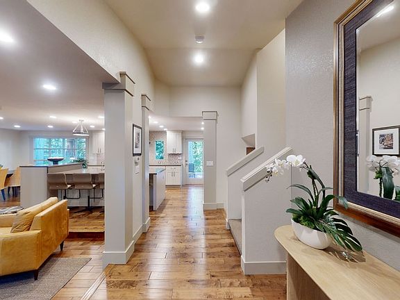 Wonderful flow from the front door: upstairs to the bedrooms, downstairs to the living room or straight out the back door to your outdoor oasis!>