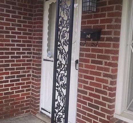 Front door with light and ironworks