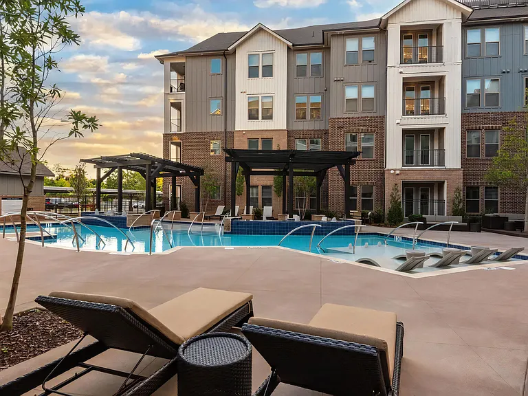 Relax Beside the Pool with In-Water Seating and Sundeck Access