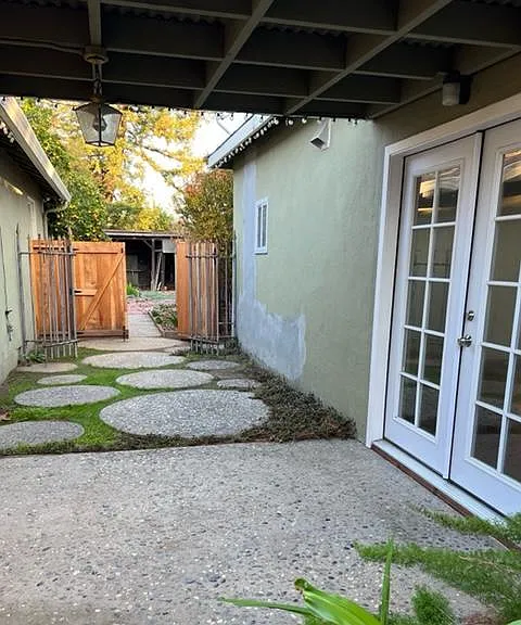 Double-door entrance into Casita/studio with full bedroom/playspace, kitchenette, refrig, full bath