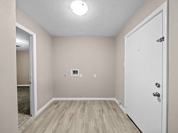 Utility Room, with exterior door to the back yard.