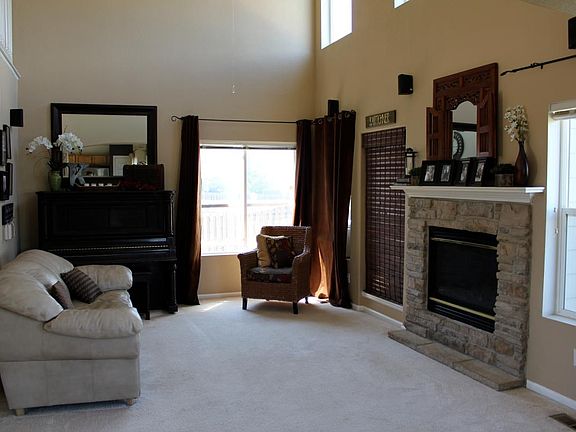 Open floor plan: kitchen, dining area, and living room; view from dining area into living room