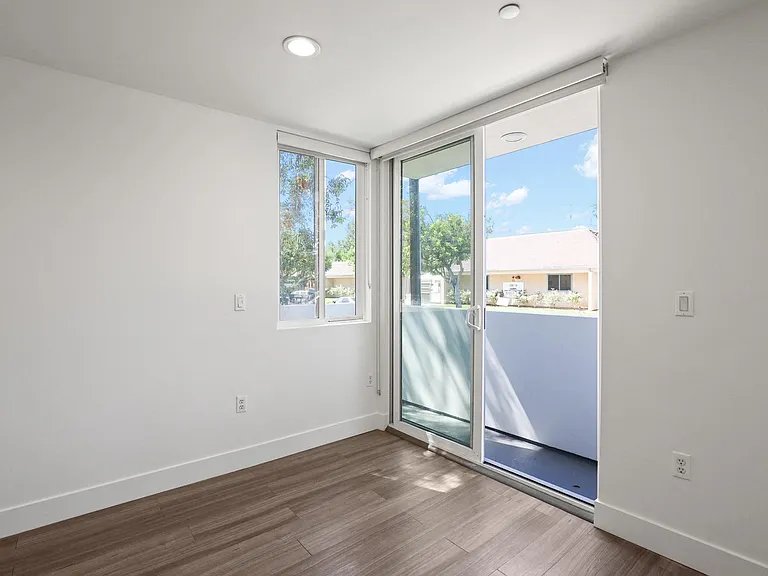 Bedroom with Windows and Patio